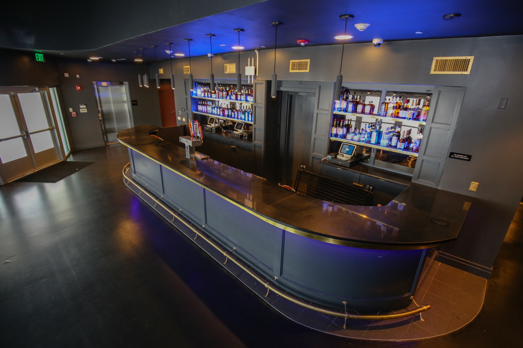 Curved lounge bar with blue under-lighting