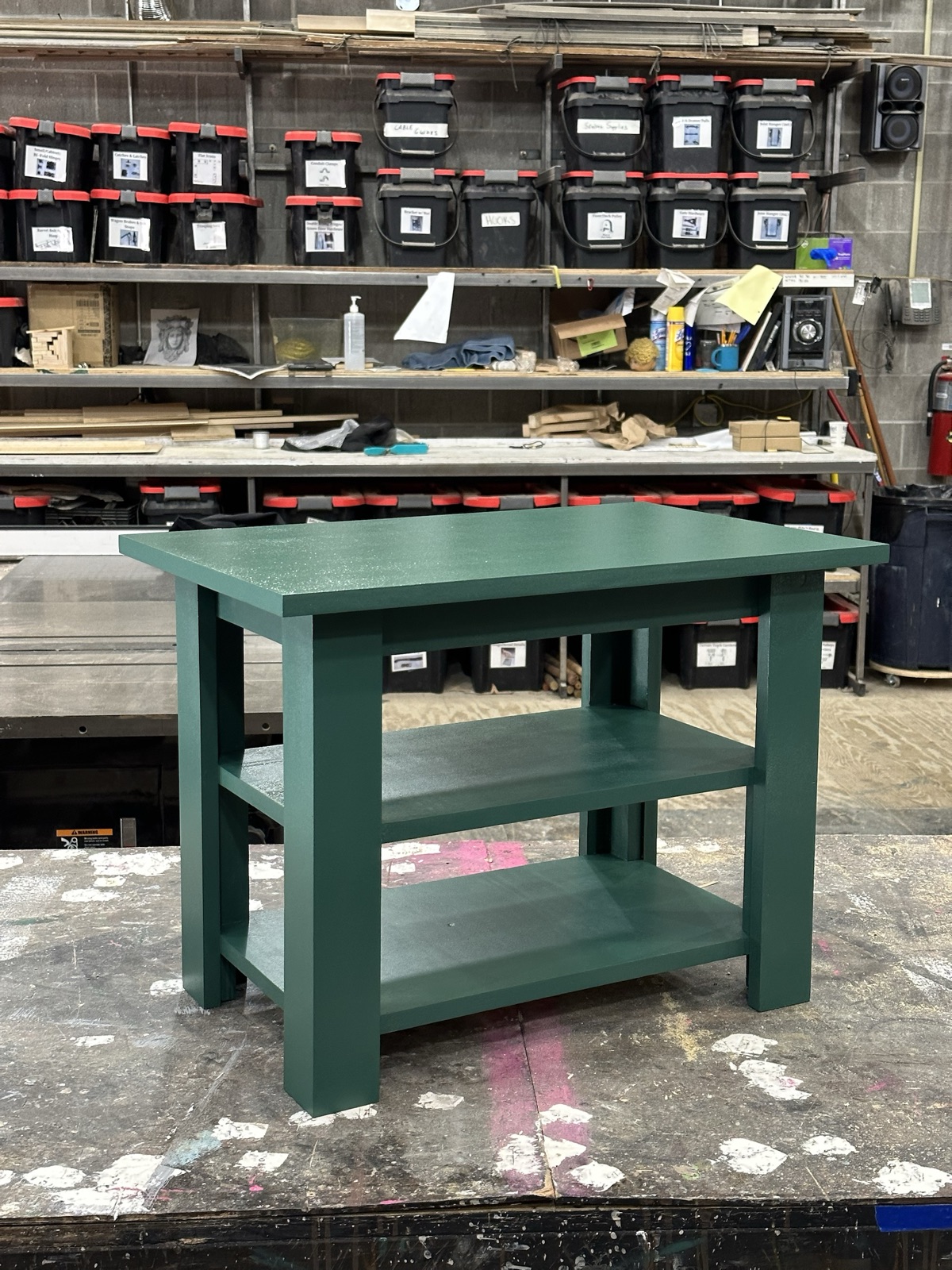 Green painted side table with two shelves in the shop
