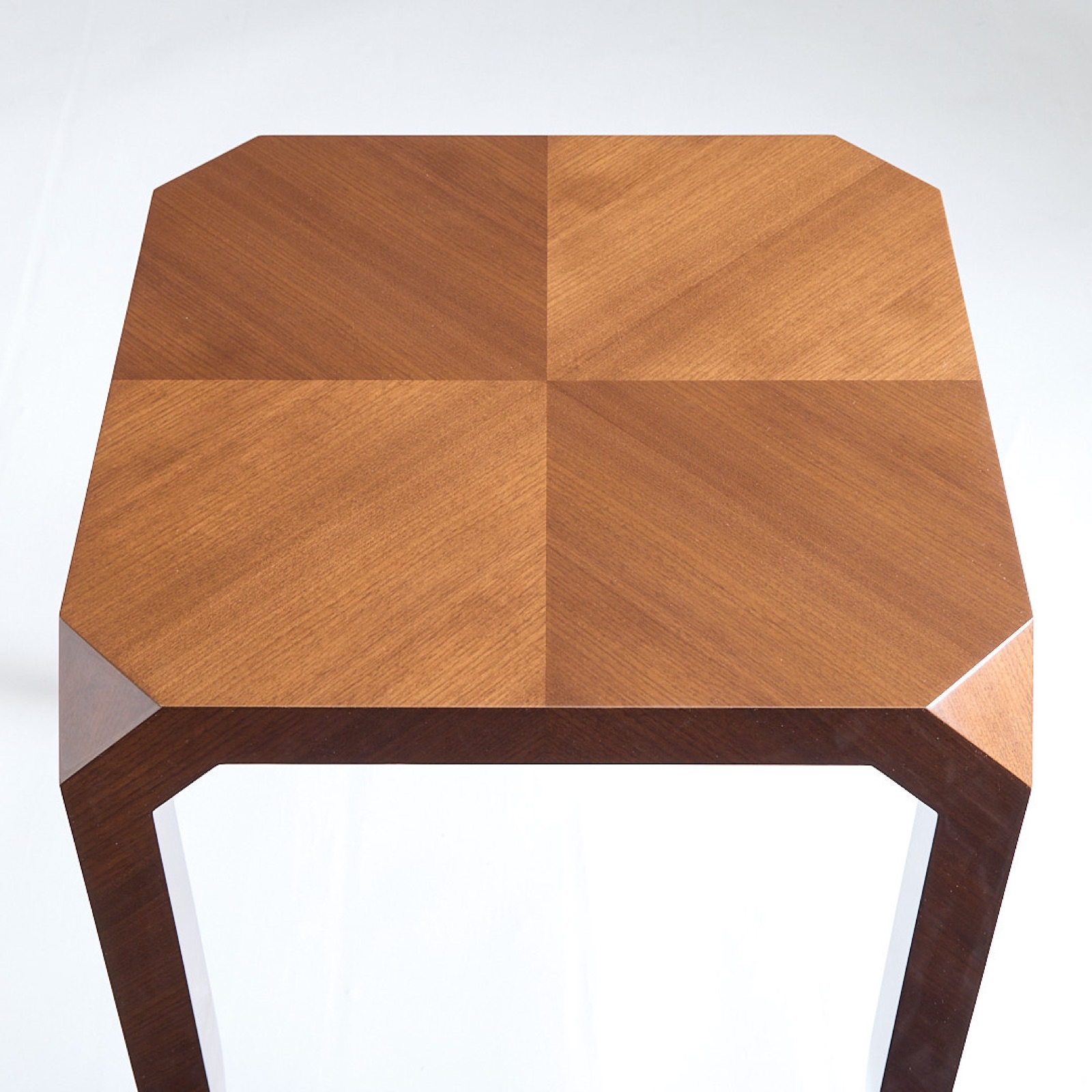Top view of a side table with a four-way book-matched top