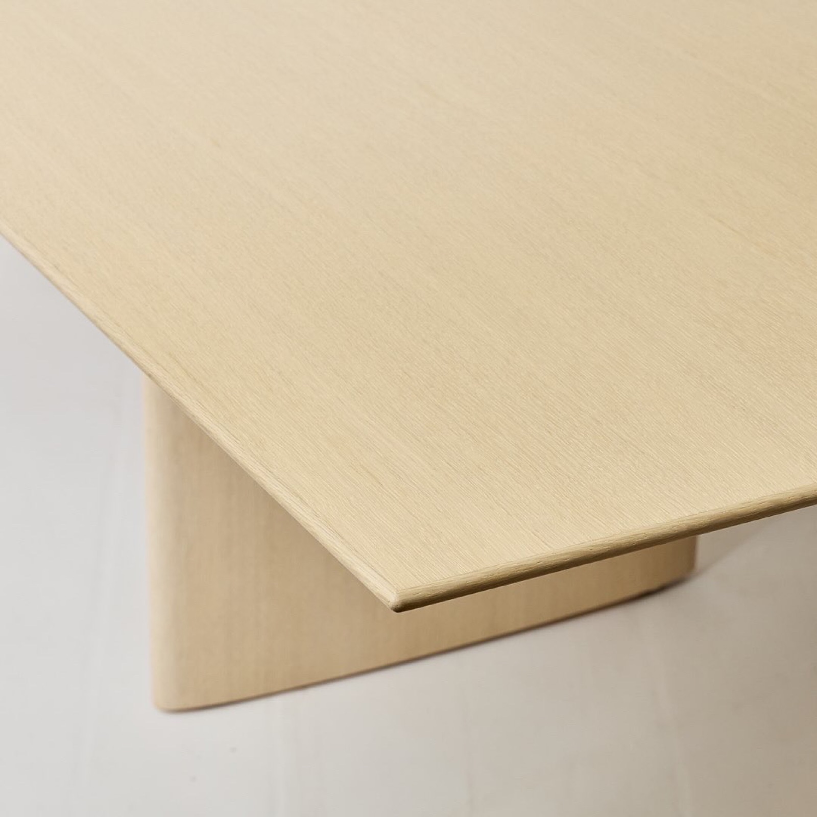 Corner of the conference table showing the thin beveled top